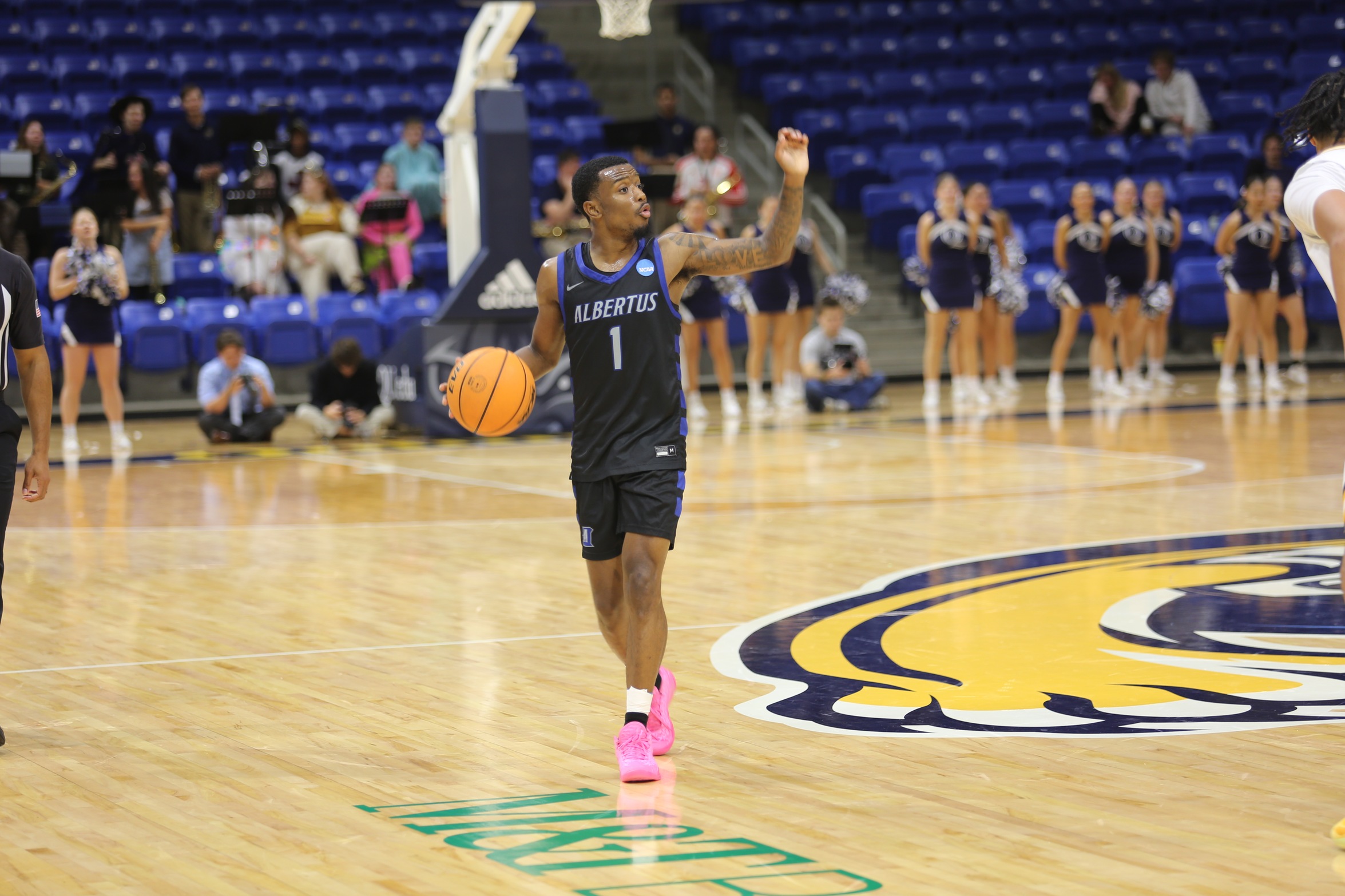 Daniels' Buzzer Beater Three Caps Off Thrilling Men's Basketball Victory at Emerson For First Win